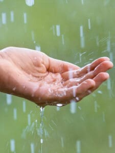 34839005 - water droplets falling into the hand