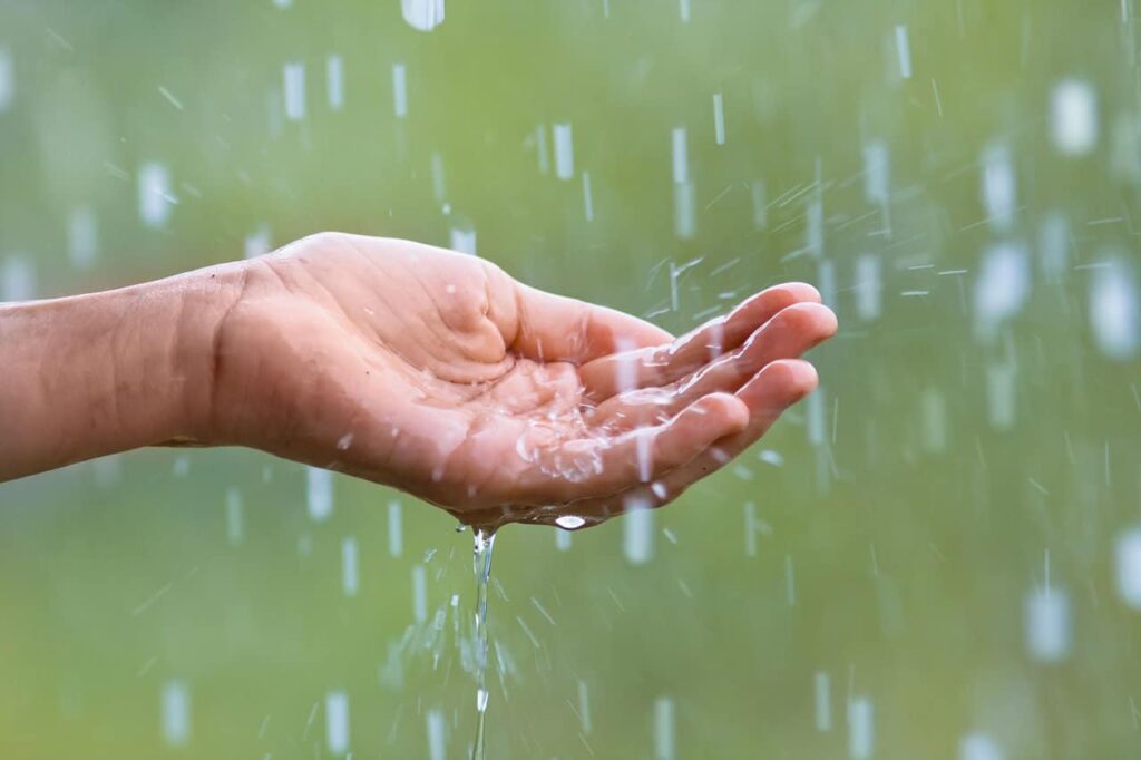 34839005 - water droplets falling into the hand